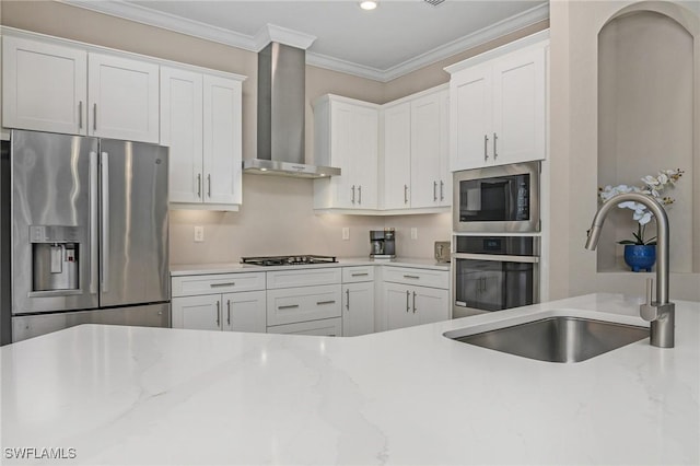 13504 Blue Bay Cir, Miromar Lakes, FL 33913 - kitchen with wall chimney range hood, white cabinets, recessed lighting, appliances with stainless steel finishes, and a sink
