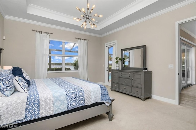 13504 Blue Bay Cir, Miromar Lakes, FL 33913 - bedroom featuring a chandelier, a tray ceiling, light colored carpet, and crown molding