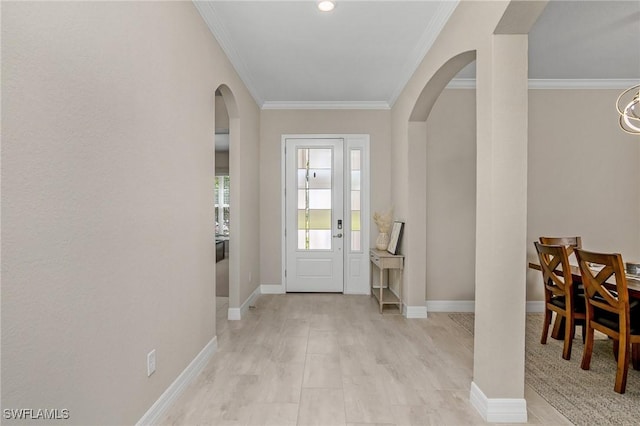 13504 Blue Bay Cir, Miromar Lakes, FL 33913 - entrance foyer featuring arched walkways, baseboards, and crown molding