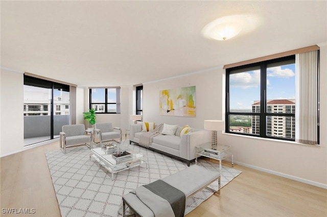 6001 Pelican Bay Blvd Unit 1506, Naples, FL 34108 - living room with wood finished floors and baseboards