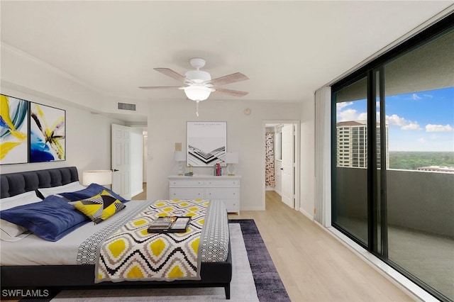 bedroom with light wood-style floors, ceiling fan, visible vents, and access to outside