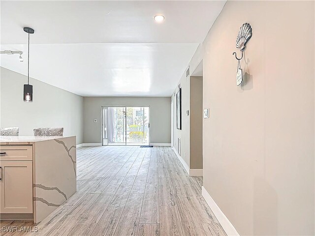 1320 Blue Point Ave Unit 2, Naples, FL 34102 - unfurnished living room with light wood-style flooring and baseboards