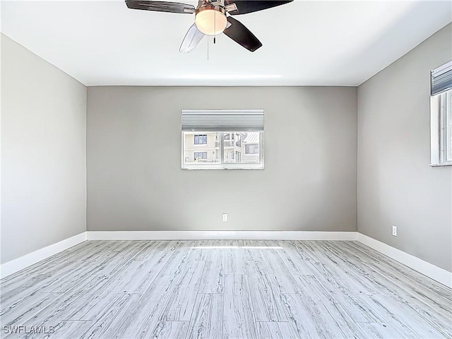 1320 Blue Point Ave Unit 2, Naples, FL 34102 - spare room with ceiling fan, wood finished floors, and baseboards