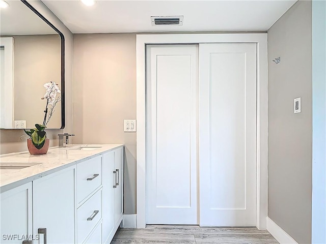 1320 Blue Point Ave Unit 2, Naples, FL 34102 - full bath featuring wood finished floors, double vanity, baseboards, and recessed lighting