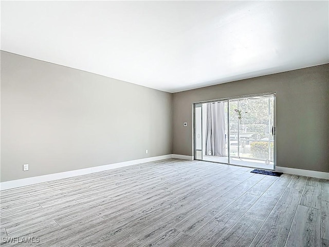 1320 Blue Point Ave Unit 2, Naples, FL 34102 - spare room featuring light wood-style floors and baseboards