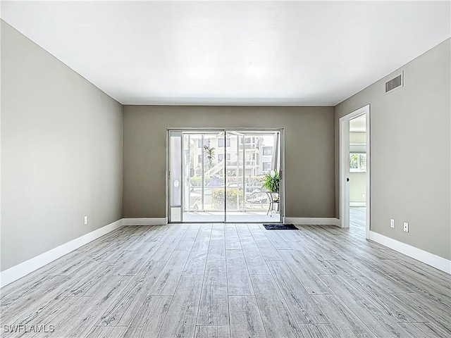 1320 Blue Point Ave Unit 2, Naples, FL 34102 - spare room with light wood finished floors and baseboards