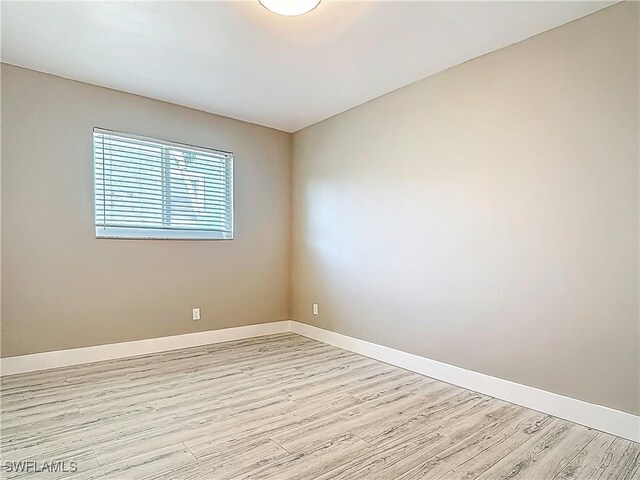 1320 Blue Point Ave Unit 2, Naples, FL 34102 - spare room featuring light wood-style floors and baseboards