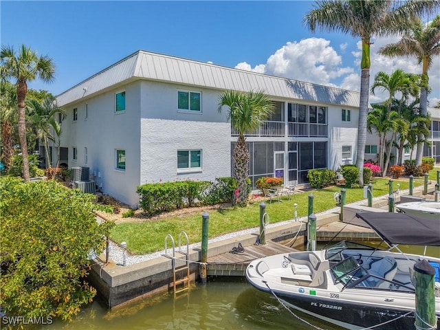 1320 Blue Point Ave Unit 2, Naples, FL 34102 - back of property featuring stucco siding, a water view, and metal roof