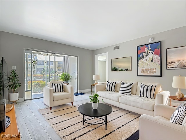 1320 Blue Point Ave Unit 2, Naples, FL 34102 - living room with light wood-style floors and baseboards