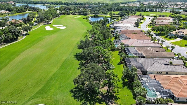 bird's eye view featuring a water view, golf course view, and a residential view