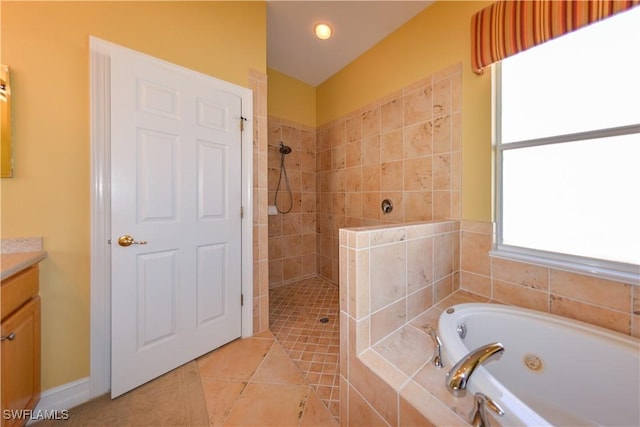 bathroom featuring tiled shower, vanity, a bath, and tile patterned flooring