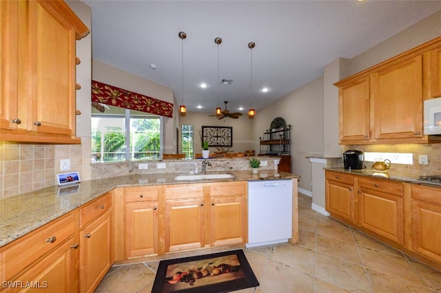 kitchen featuring tasteful backsplash, white appliances, a peninsula, a ceiling fan, and a sink