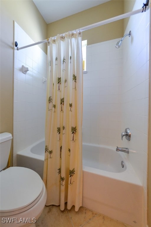 bathroom with toilet, shower / bath combo, and tile patterned flooring
