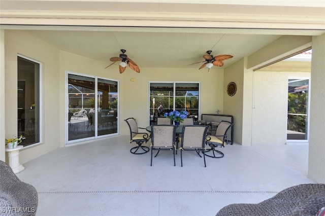 view of patio with a ceiling fan and outdoor dining area