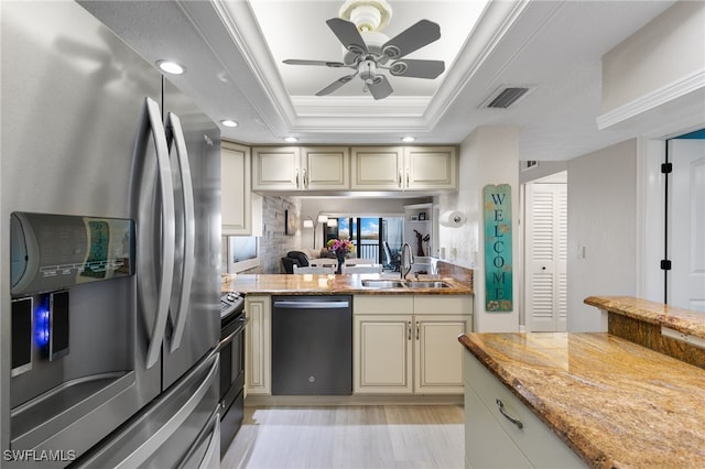 4835 Bonita Beach Rd Unit 407, Bonita Springs, FL 34135 - kitchen featuring visible vents, a sink, appliances with stainless steel finishes, a ceiling fan, and a tray ceiling