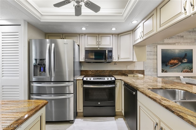 4835 Bonita Beach Rd Unit 407, Bonita Springs, FL 34135 - kitchen with crown molding, a raised ceiling, a ceiling fan, and stainless steel appliances