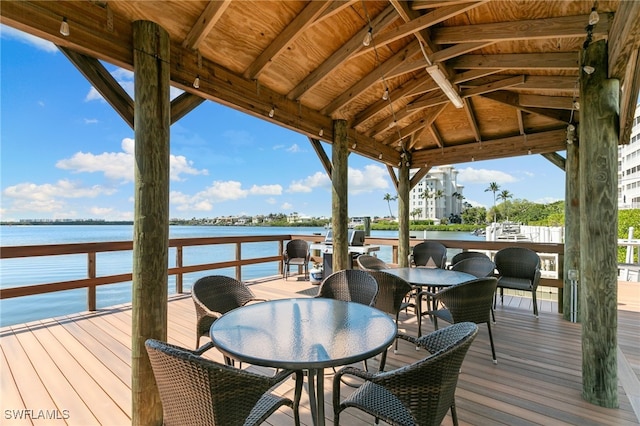 4835 Bonita Beach Rd Unit 407, Bonita Springs, FL 34135 - dock area featuring a deck with water view and outdoor dining area