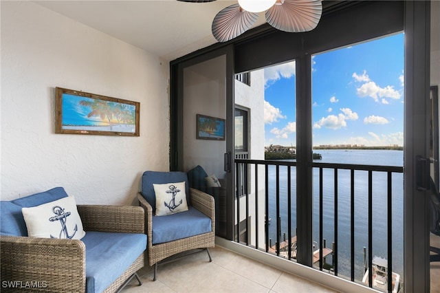 4835 Bonita Beach Rd Unit 407, Bonita Springs, FL 34135 - interior space with a water view, a ceiling fan, and tile patterned flooring