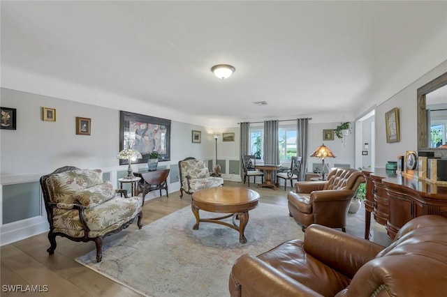 2135 SE 15th St, Cape Coral, FL 33990 - living area with healthy amount of natural light and wood finished floors