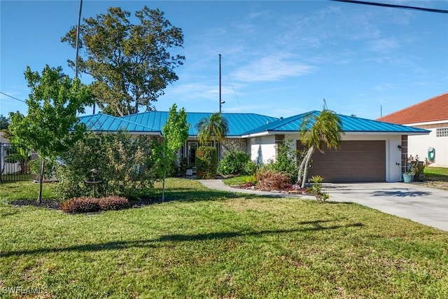 2135 SE 15th St, Cape Coral, FL 33990 - view of front of home featuring a garage, driveway, a front yard, a metal roof, and a standing seam roof