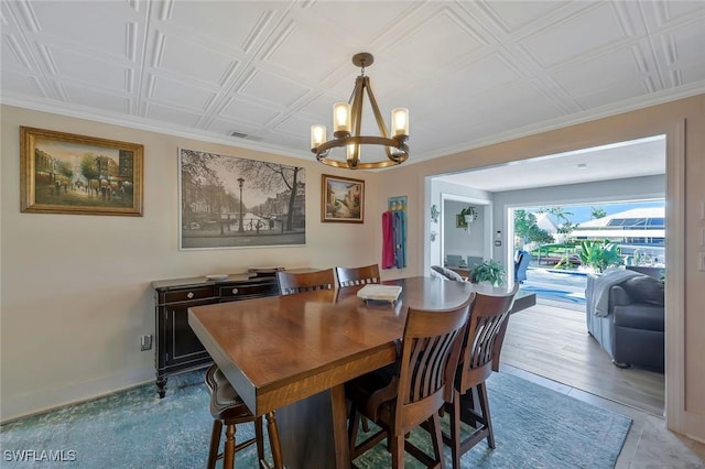 2135 SE 15th St, Cape Coral, FL 33990 - dining space with a chandelier and an ornate ceiling