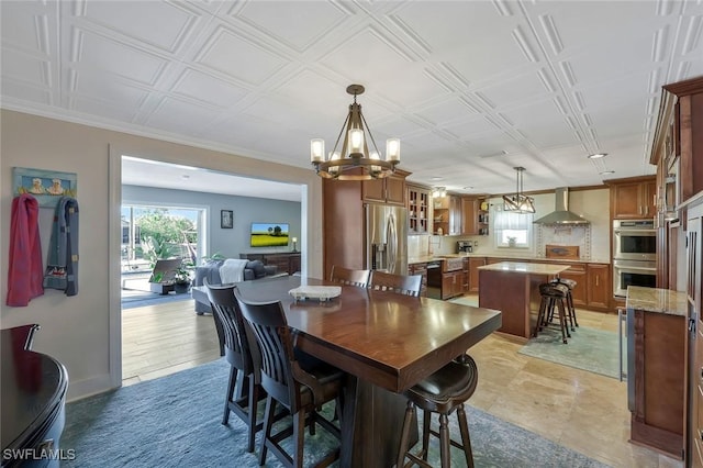 2135 SE 15th St, Cape Coral, FL 33990 - dining space featuring a chandelier