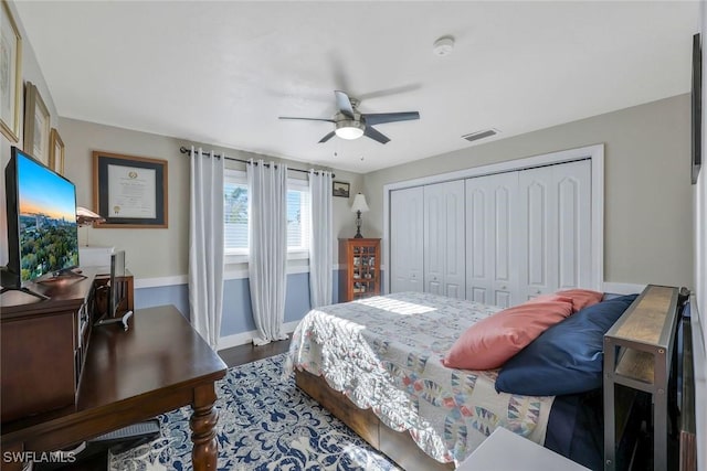 2135 SE 15th St, Cape Coral, FL 33990 - bedroom featuring a closet, ceiling fan, wood finished floors, and an office area