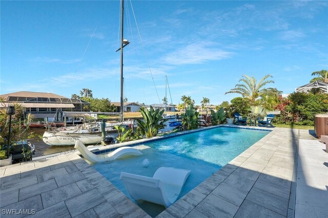 2135 SE 15th St, Cape Coral, FL 33990 - swimming pool featuring a boat dock and a patio