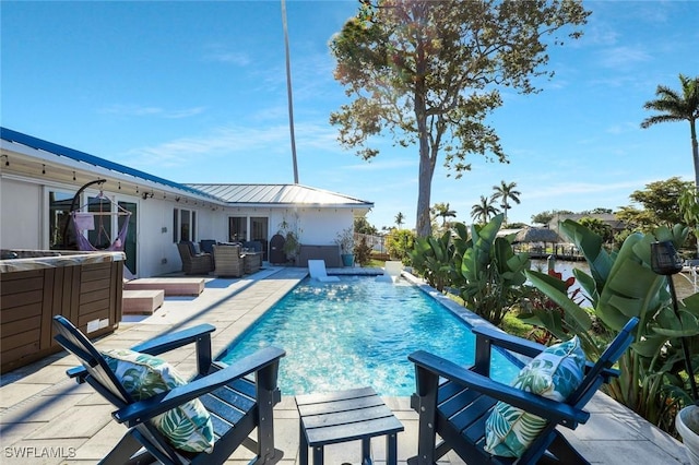 2135 SE 15th St, Cape Coral, FL 33990 - view of pool with a patio area, outdoor lounge area, and a hot tub