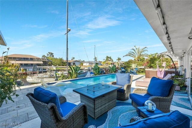 2135 SE 15th St, Cape Coral, FL 33990 - view of patio featuring an outdoor pool and an outdoor living space