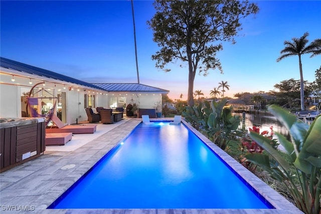 2135 SE 15th St, Cape Coral, FL 33990 - view of swimming pool featuring an outdoor hot tub and a patio