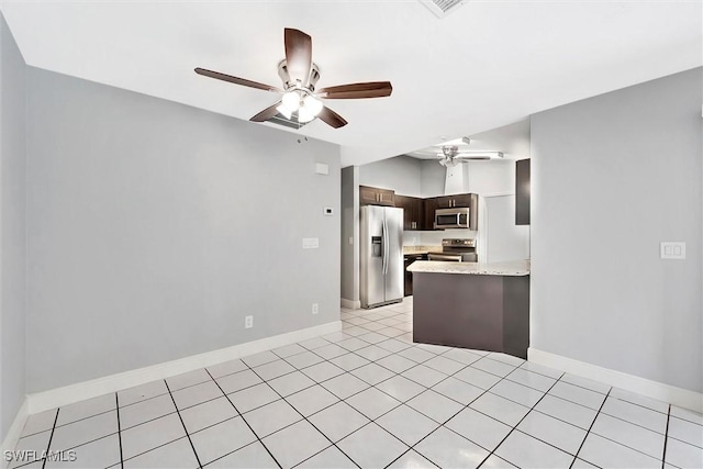 27375 Imperial Oaks Cir, Bonita Springs, FL 34135 - kitchen featuring dark brown cabinetry, a peninsula, light countertops, a ceiling fan, and stainless steel appliances