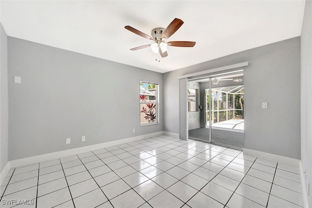 27375 Imperial Oaks Cir, Bonita Springs, FL 34135 - spare room featuring ceiling fan, light tile patterned flooring, and baseboards
