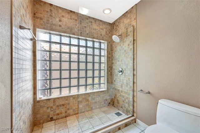 27375 Imperial Oaks Cir, Bonita Springs, FL 34135 - bathroom with a walk in shower, tile patterned floors, baseboards, and toilet