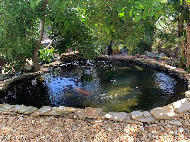 27375 Imperial Oaks Cir, Bonita Springs, FL 34135 - exterior space with a small pond