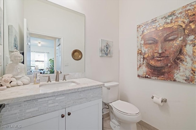5448 Agostino Way, Ave Maria, FL 34142 - half bath featuring toilet, baseboards, tile patterned flooring, and vanity