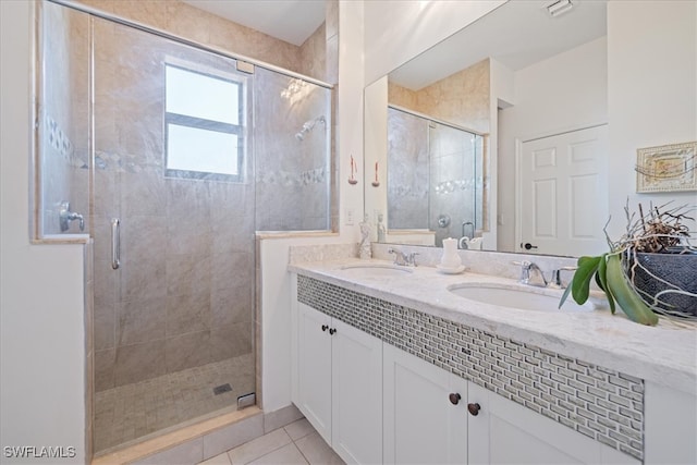 5448 Agostino Way, Ave Maria, FL 34142 - bathroom with a shower stall, a sink, and tile patterned flooring
