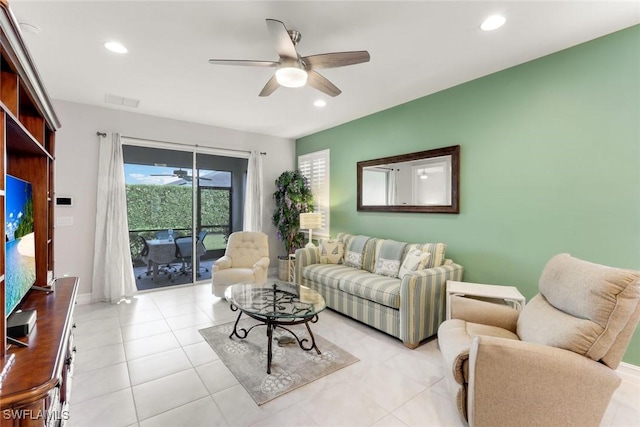 living room with ceiling fan, visible vents, and recessed lighting