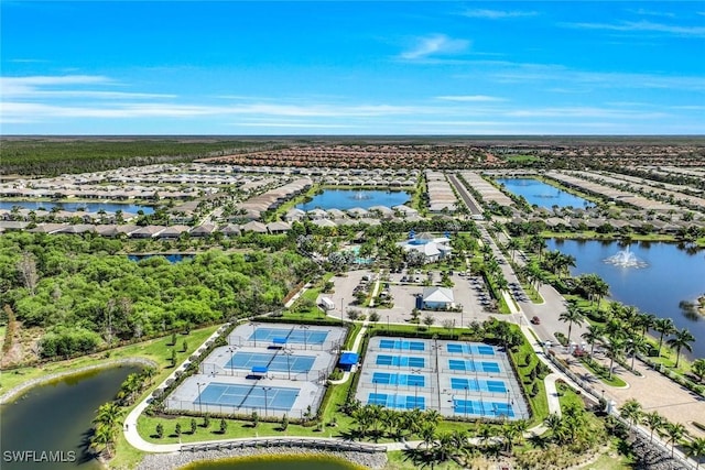 birds eye view of property featuring a water view and a residential view