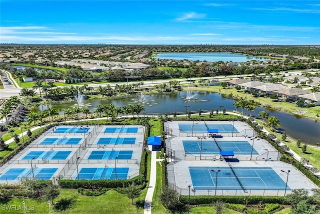 drone / aerial view featuring a residential view and a water view