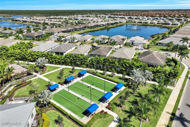 birds eye view of property with a water view and a residential view