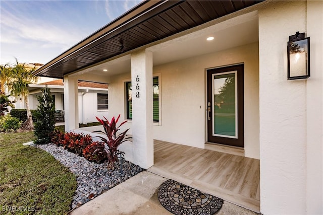 668 104th Ave N, Naples, FL 34108 - entrance to property featuring a porch and stucco siding