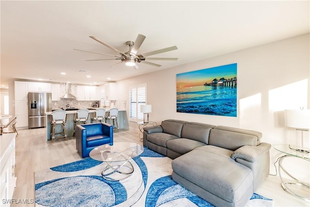 668 104th Ave N, Naples, FL 34108 - living area with recessed lighting, ceiling fan, and light wood-style floors