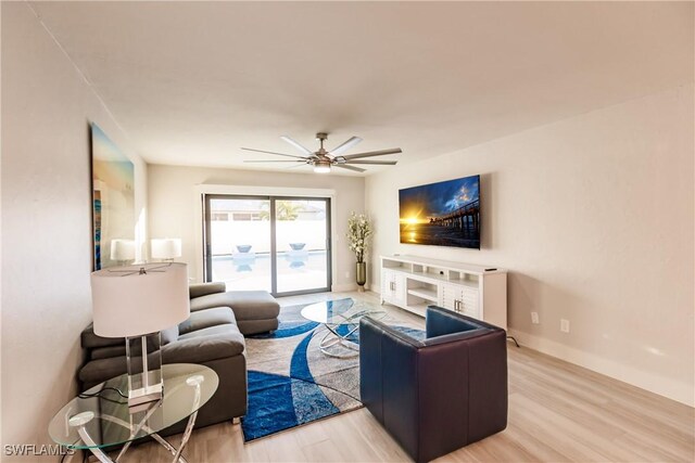 668 104th Ave N, Naples, FL 34108 - living area with baseboards, ceiling fan, and wood finished floors