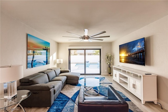 668 104th Ave N, Naples, FL 34108 - living area with baseboards, a ceiling fan, and light wood-style flooring