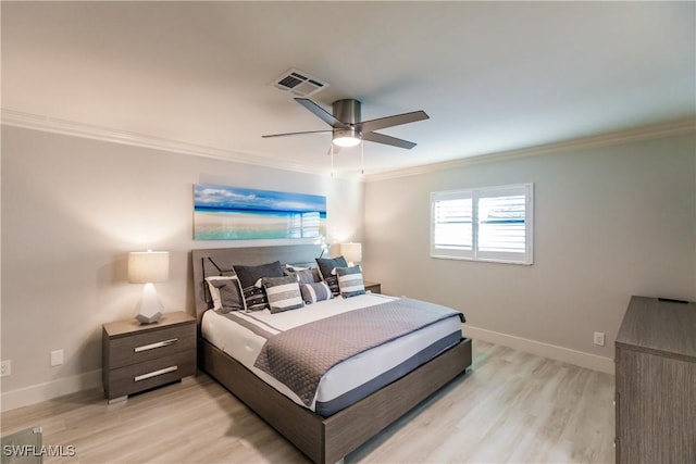 668 104th Ave N, Naples, FL 34108 - bedroom with light wood-style floors, baseboards, ornamental molding, and visible vents