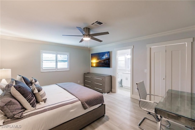 668 104th Ave N, Naples, FL 34108 - bedroom with visible vents, ornamental molding, light wood-style flooring, and ensuite bathroom