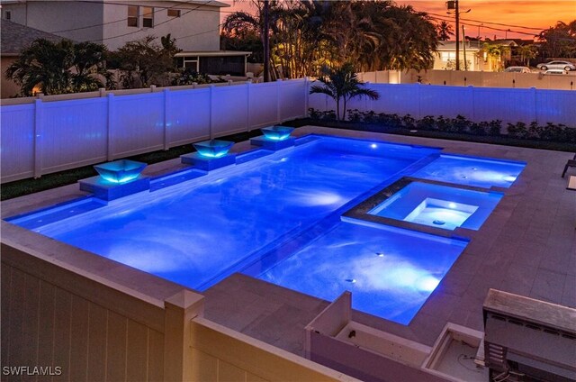 668 104th Ave N, Naples, FL 34108 - view of pool with a fenced backyard and a pool with connected hot tub
