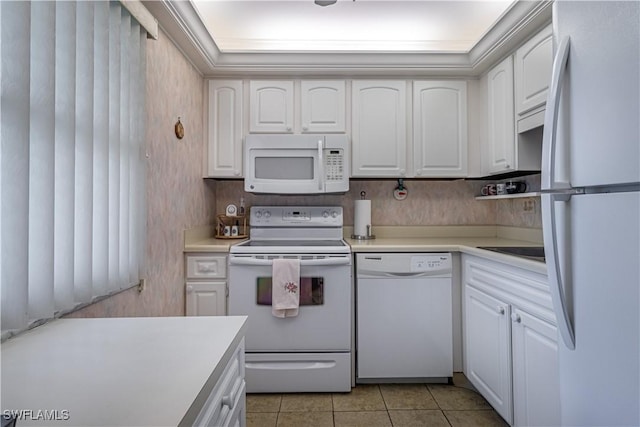 1624 Pine Valley Dr Unit 212, Fort Myers, FL 33907 - kitchen with white cabinets, light countertops, white appliances, and light tile patterned flooring