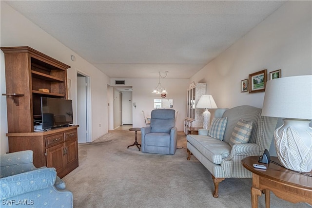 1624 Pine Valley Dr Unit 212, Fort Myers, FL 33907 - living area featuring a chandelier, light colored carpet, and visible vents